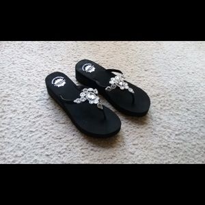 Yellow Box black sandals.