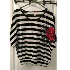 Black and white striped shirt with floral accent