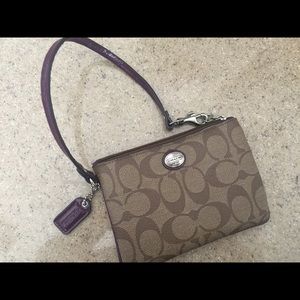 Coach wristlet with purple trim