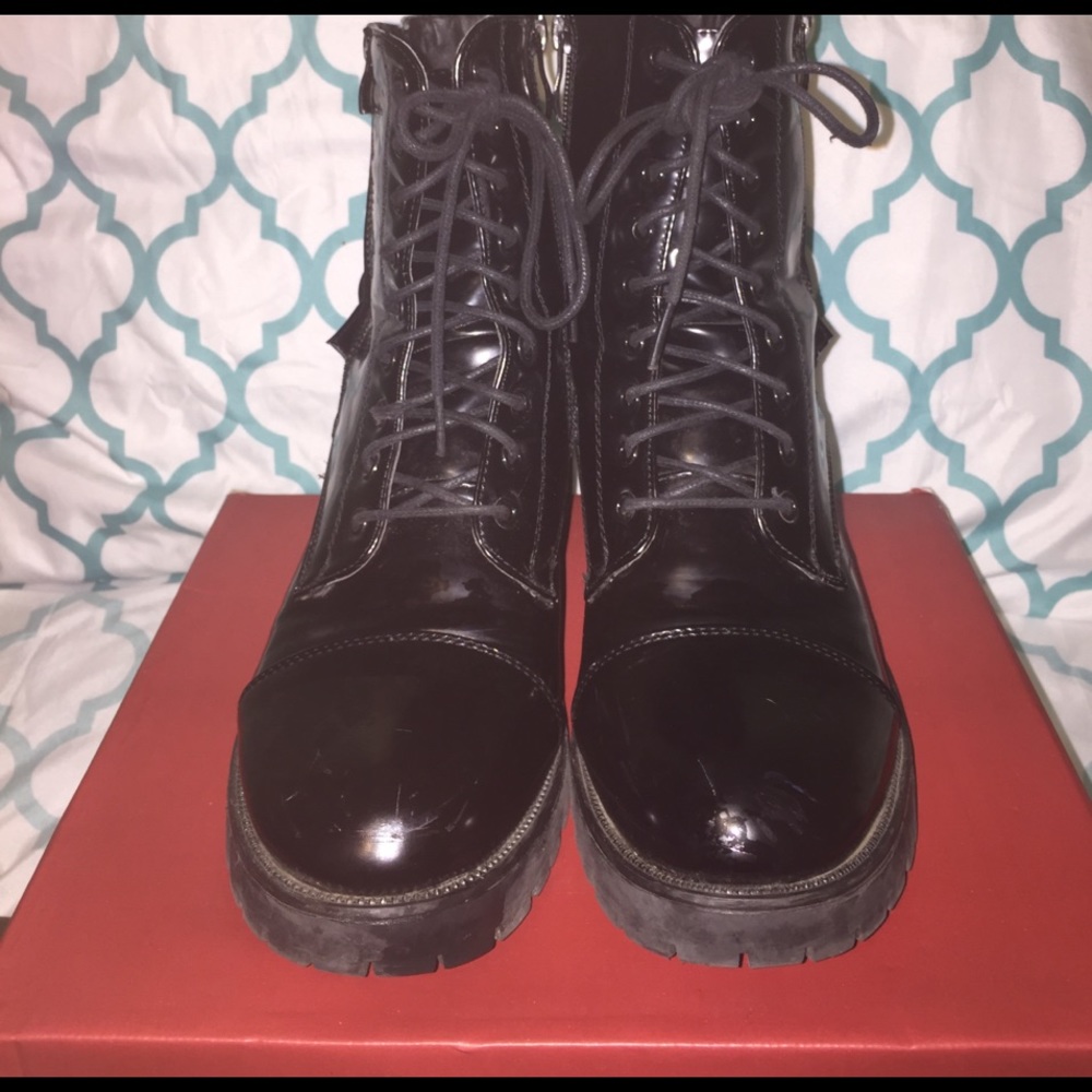 Black glossy combat boots