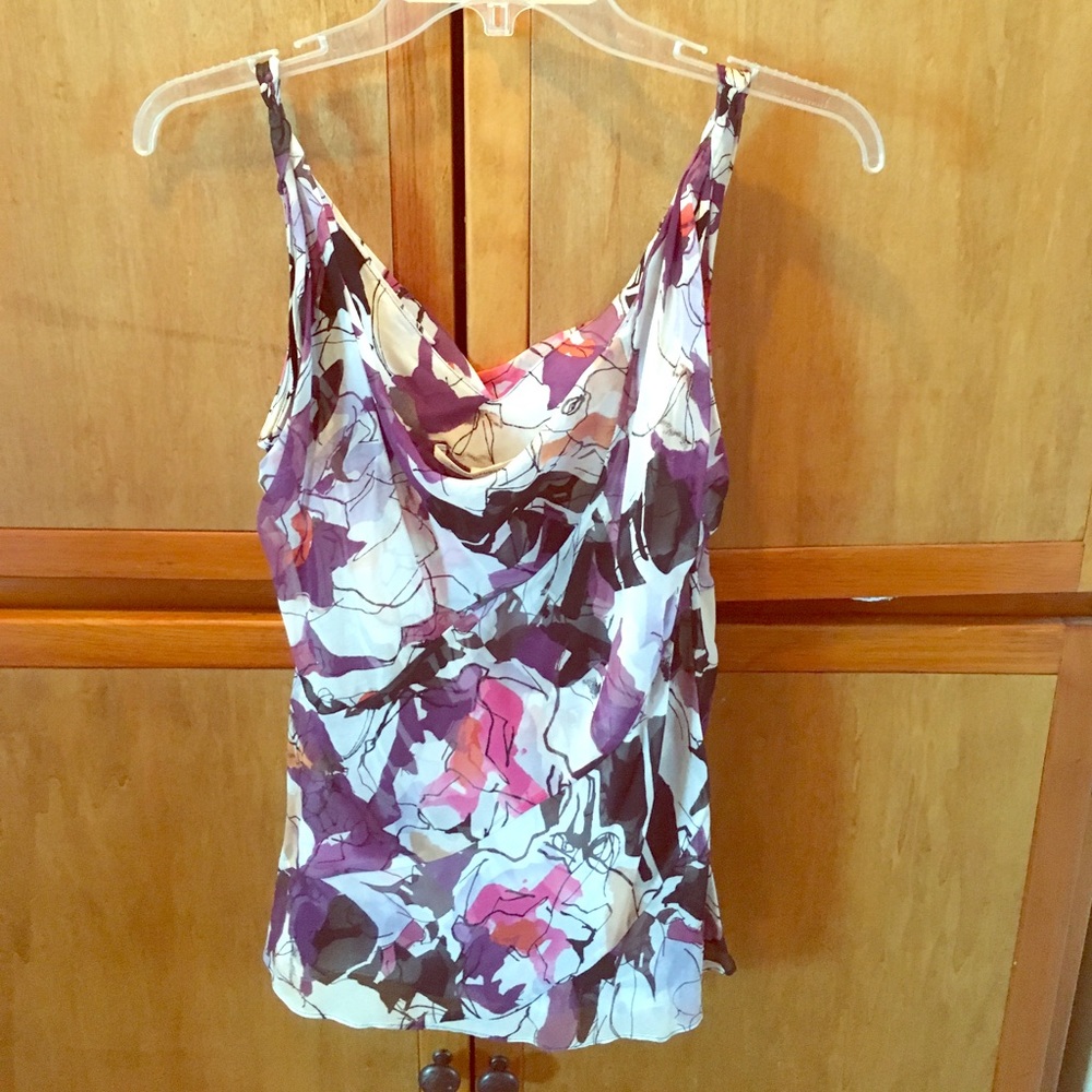 DVF sleeveless blouse in floral pattern.