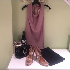 Shy, flirty nude satin sleeveless top