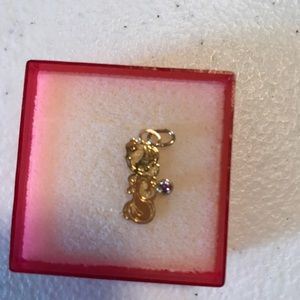 Precious moments girl with purple Feb. birthstone