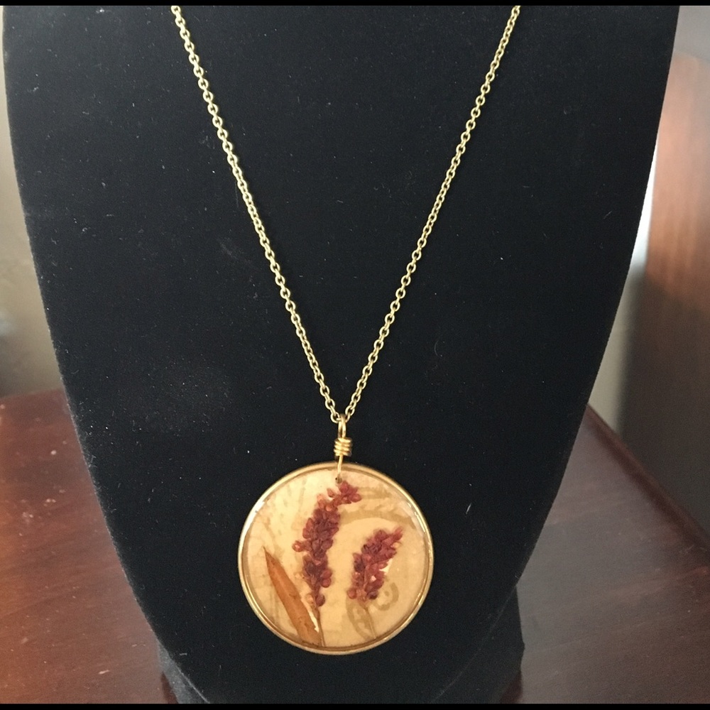 Necklace with enclosed dried flower pendant