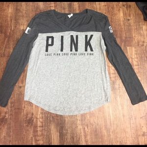 PINK thin long sleeve top with a V-neck.