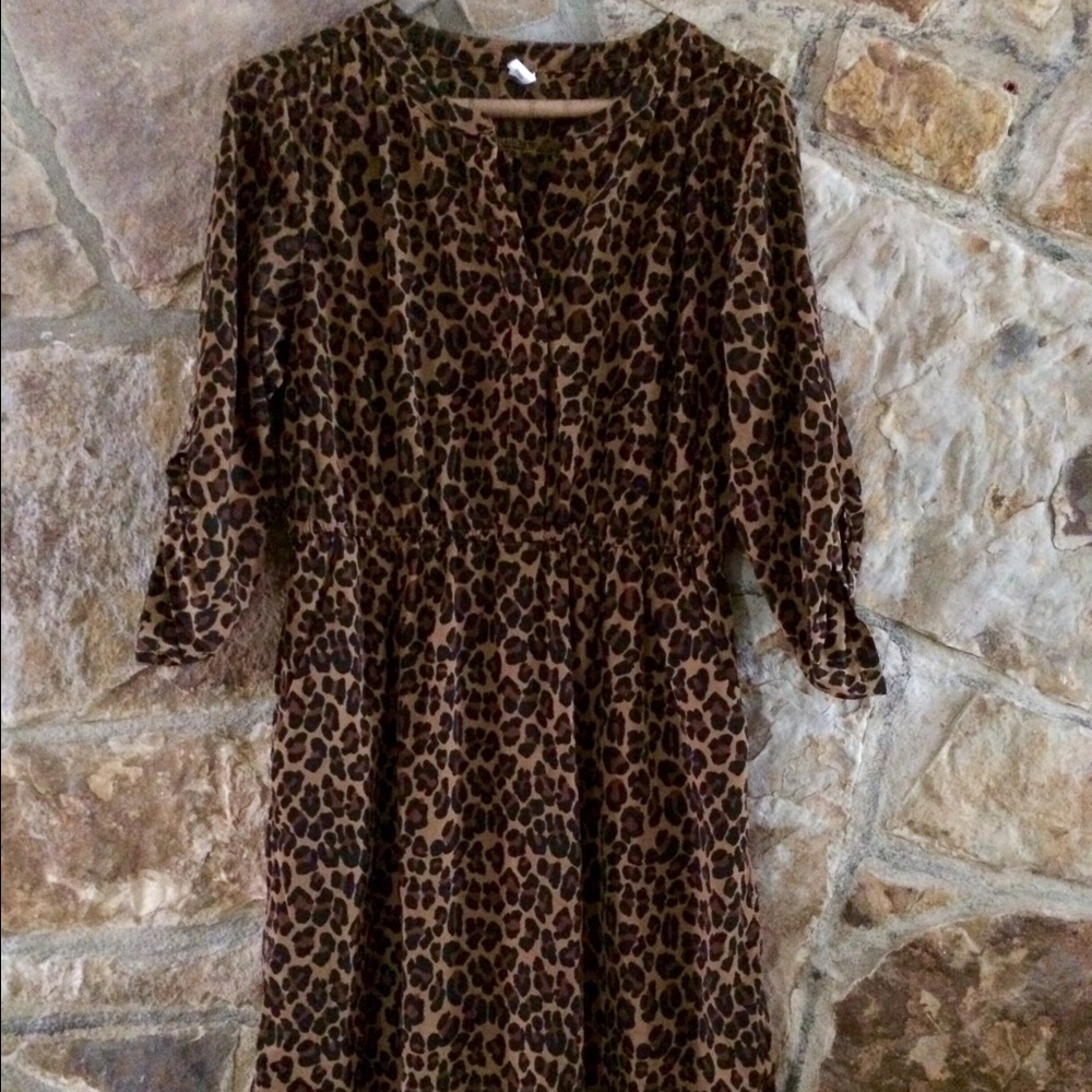 Leopard print dress. 3/4 sleeves. Hits the knee.