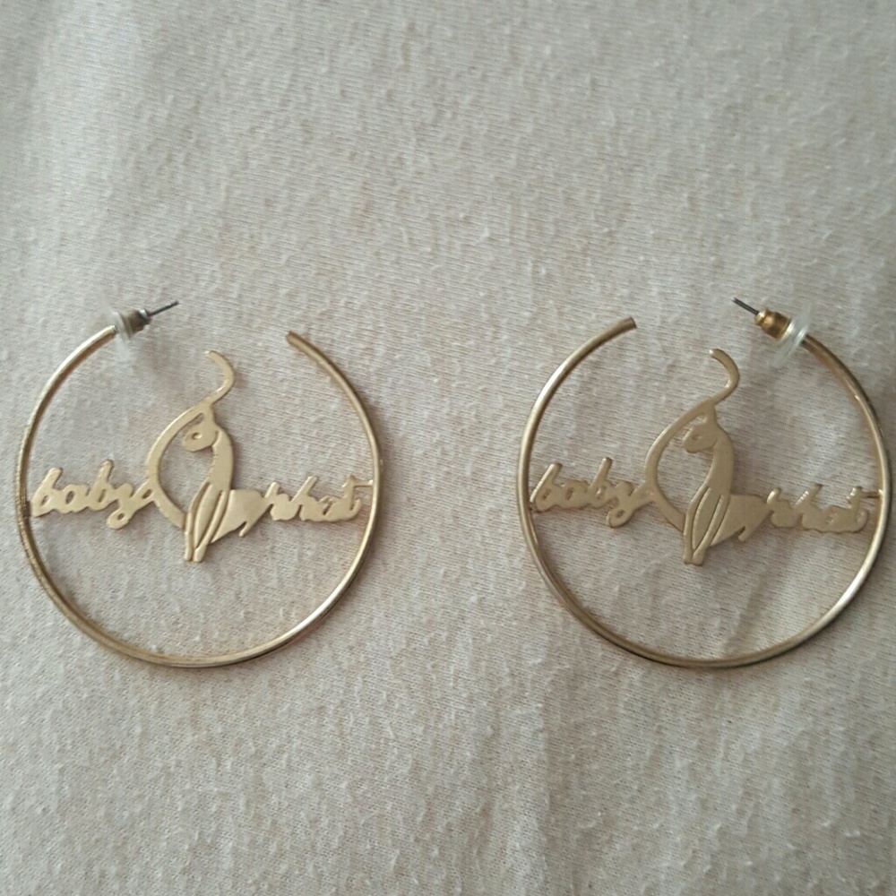 Gold in color "Baby Phat " hoop earrings.