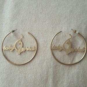 Gold in color "Baby Phat " hoop earrings.