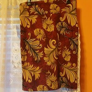 Maroon skirt with feathers
