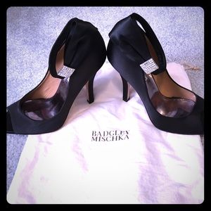 Black satin peep toe pumps with rhinestone accents