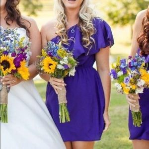 One shoulder purple dress.