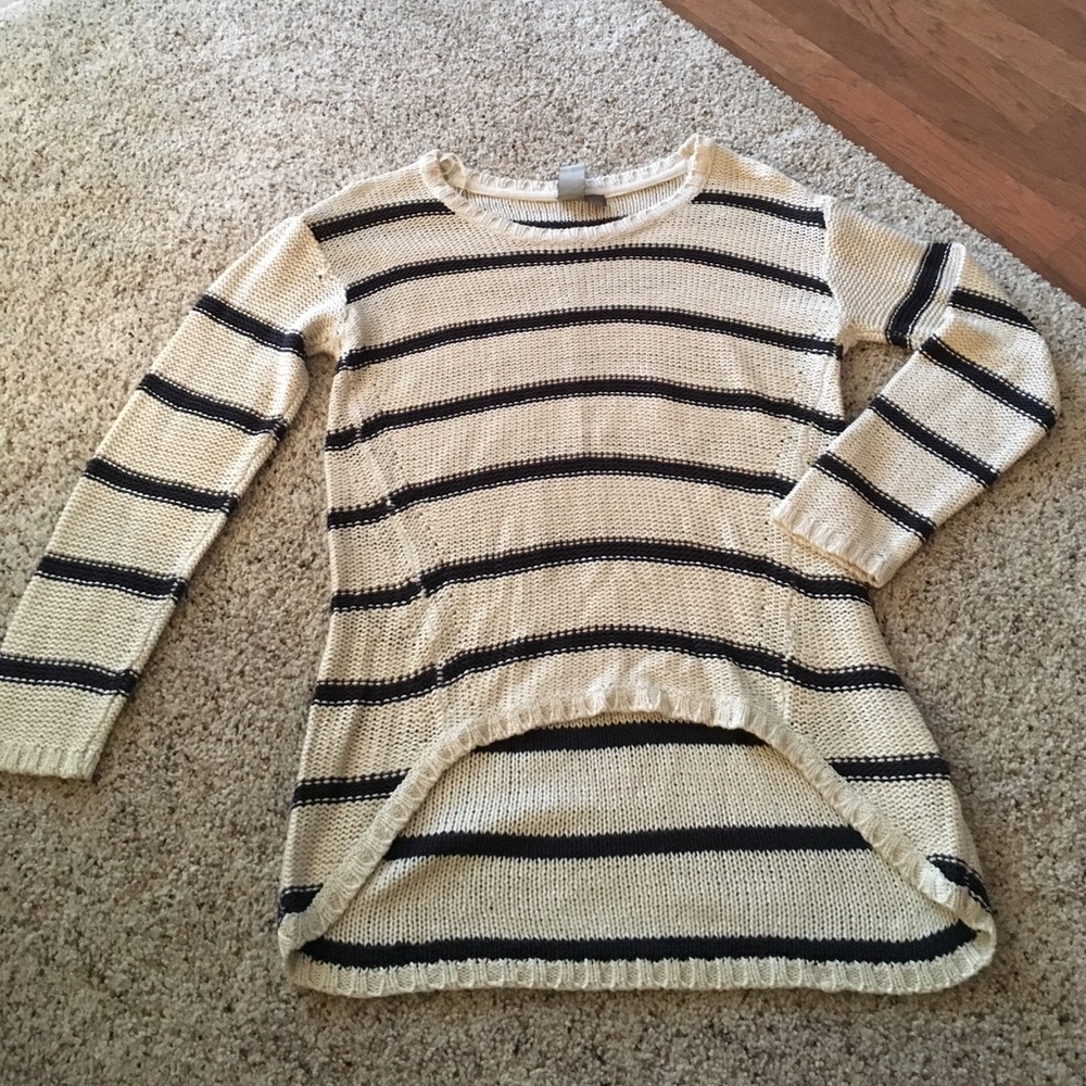 Sweater. Higher in front than back.