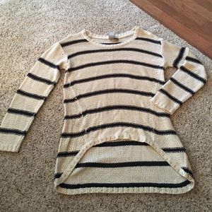 Sweater. Higher in front than back.