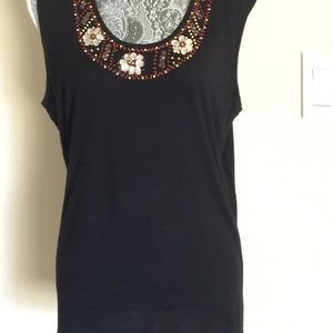 Black top.Embellished with rhinestones and beads.