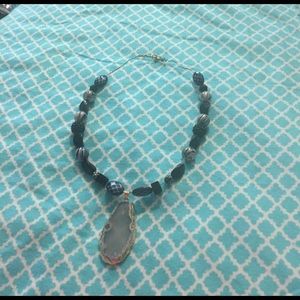 Clear quartz crystal necklace.