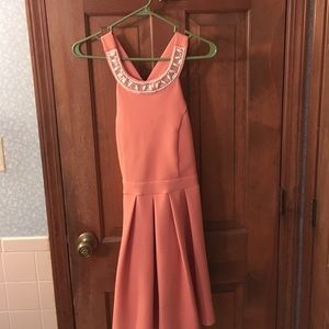 Coral dress with embellished scoop neck. ❤