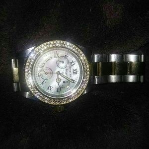 silver round face invicta chronograph watch
