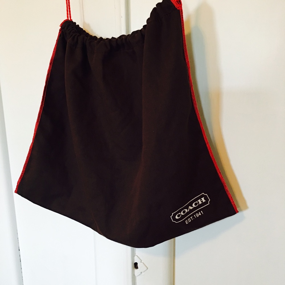 Coach dust cover bag.