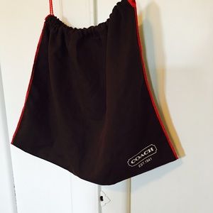 Coach dust cover bag.