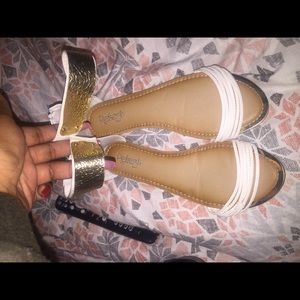 Gold and white sandals