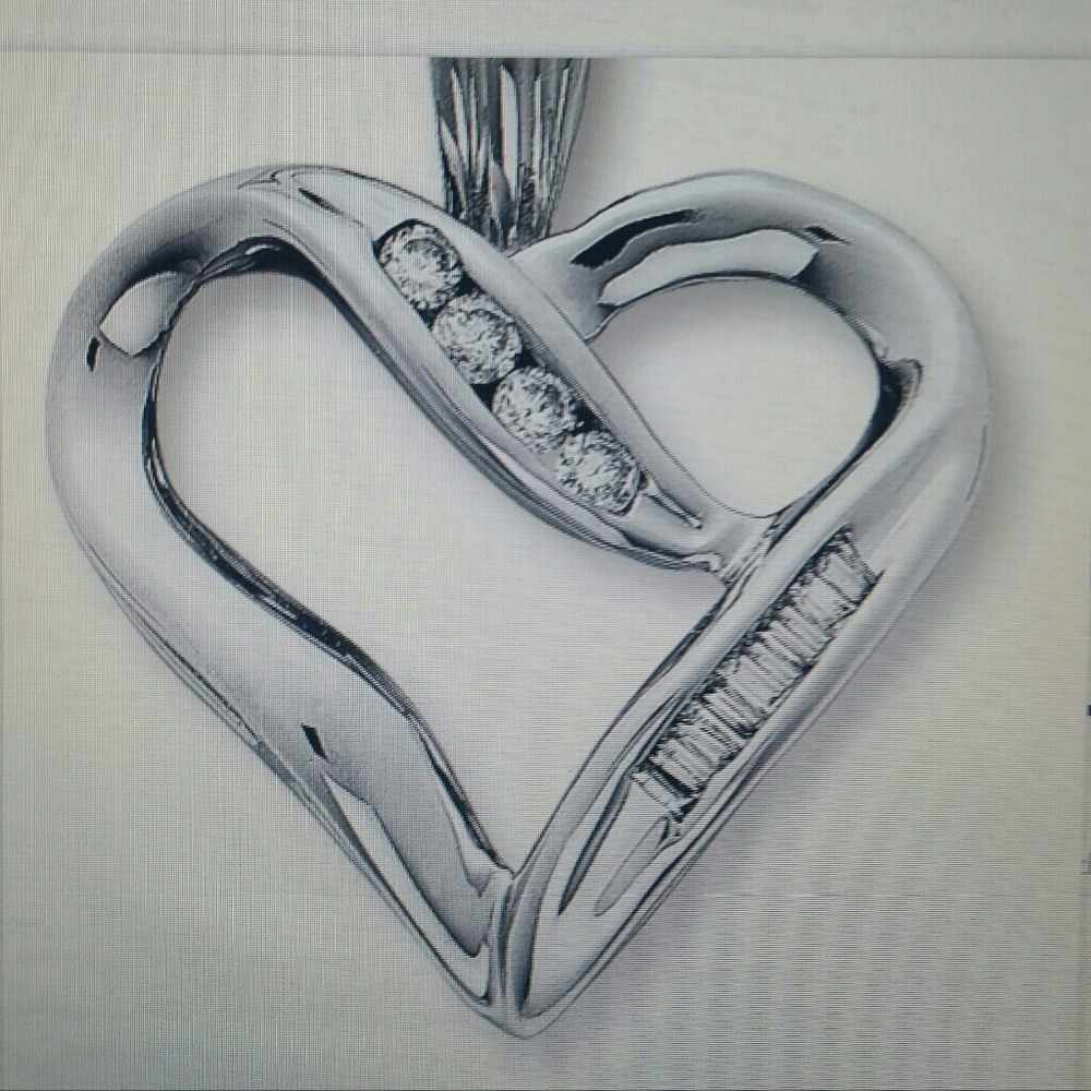 Diamond heart pendant 10 k white gold.