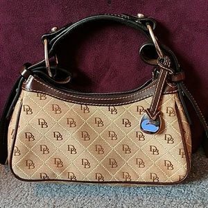Brown Dooney & Bourke purse with leather strap