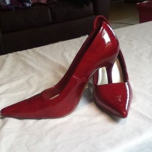 Red patent pumps