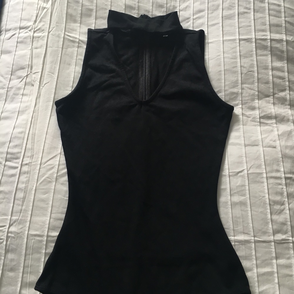 Body suit with a choker neck.
