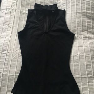 Body suit with a choker neck.