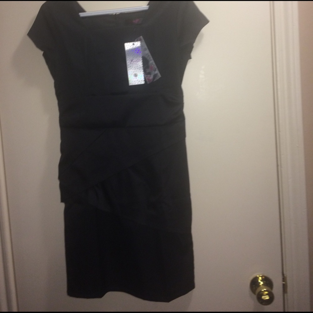 NWT. Never worn. Little black satin like dress.