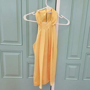 Sleeveless yellow blouse