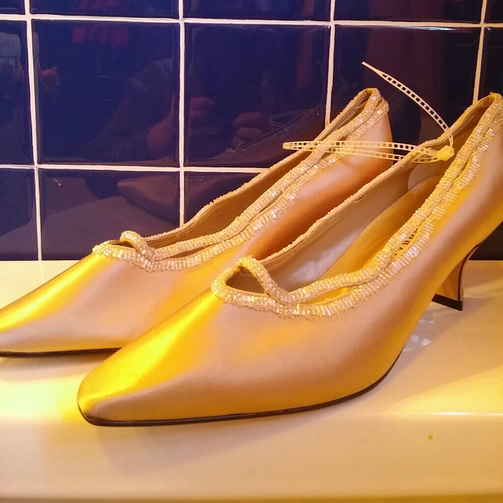 Beige matte satin with iridescent beaded trim.