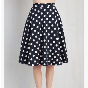 Full skirt, white polka dots on dark blue.
