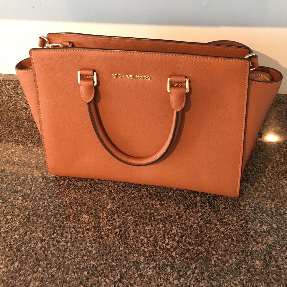 Michael Kors Selma satchel in luggage.