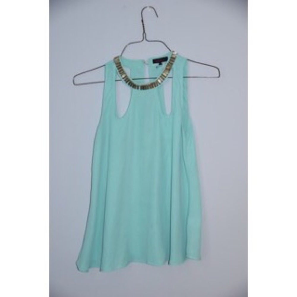 Turquoise cutout blouse.
