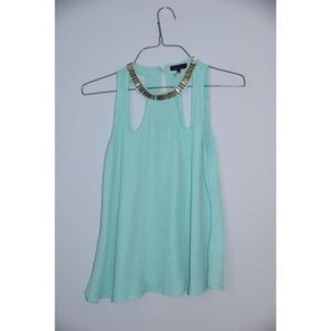 Turquoise cutout blouse.