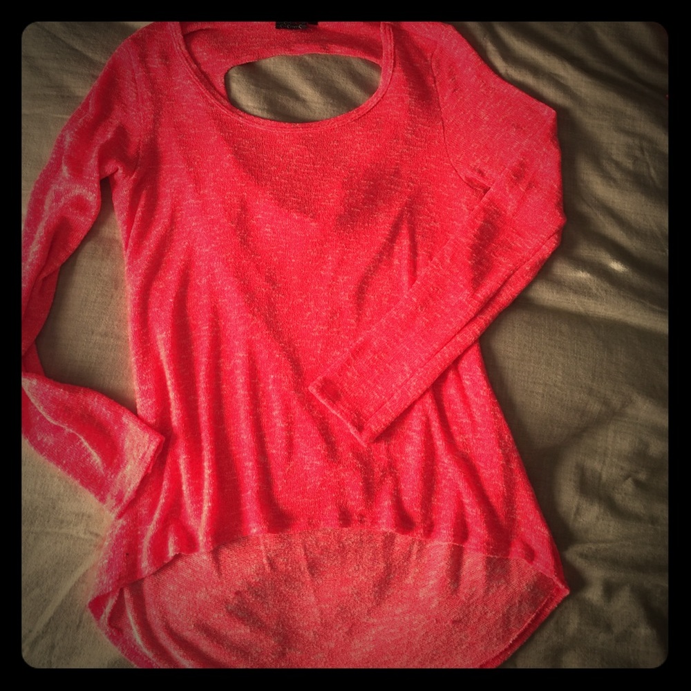 Long sleeve bright pink sweater.