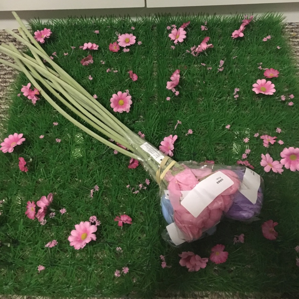 Child's play or decorative grass mat and flowers.