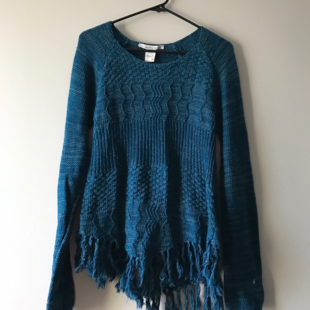 Blue sweater with tassels