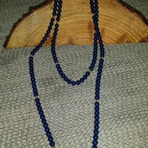 Long navy blue beaded necklace .(Monet)