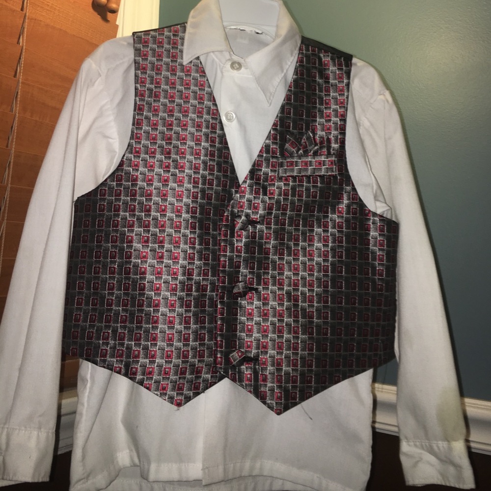 While button down shirt with plaid colored vest.