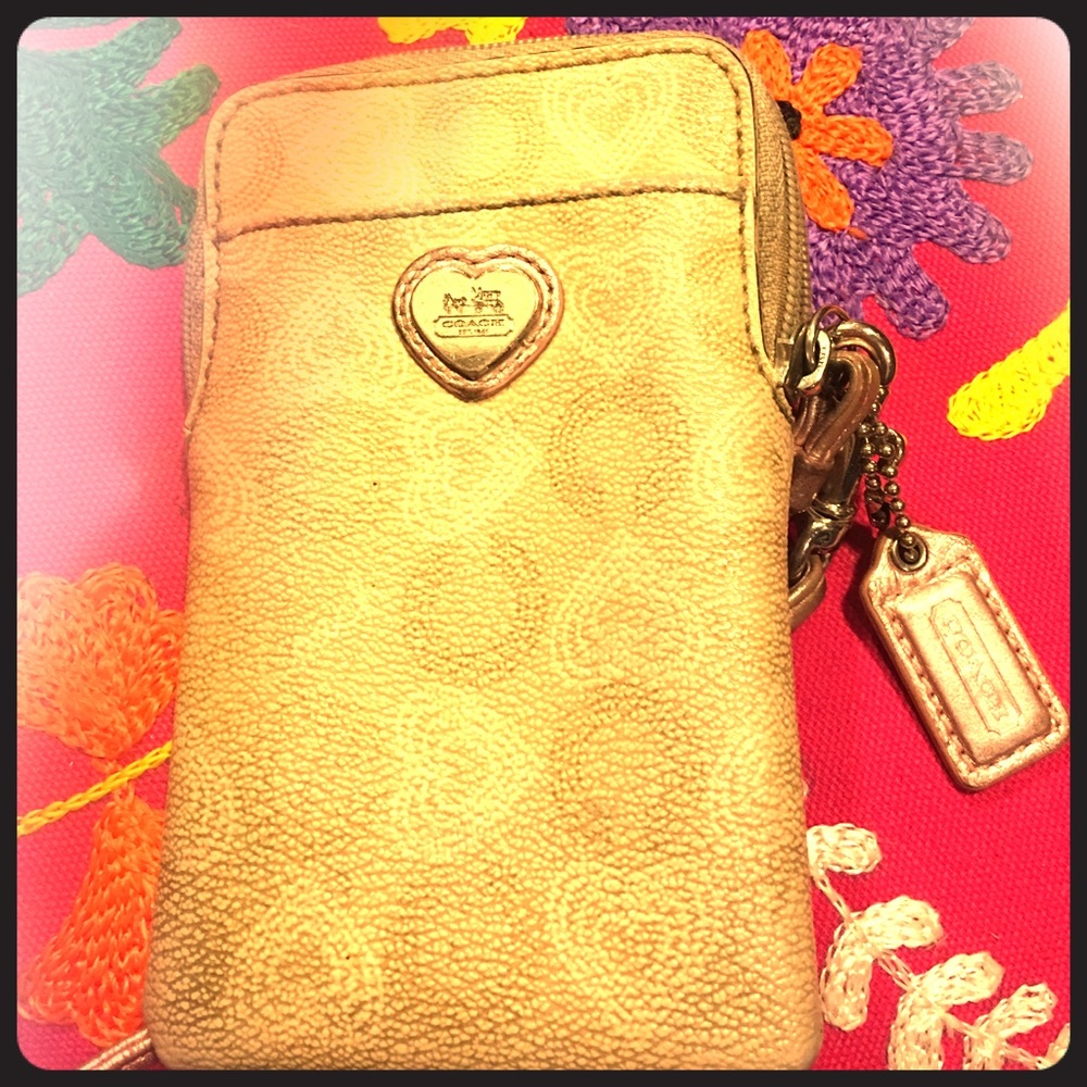 Gold and Rose Gold Coach Wallet that zips.