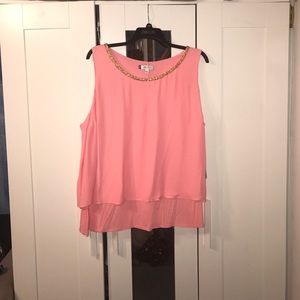 Sleeveless pink top with gold trim