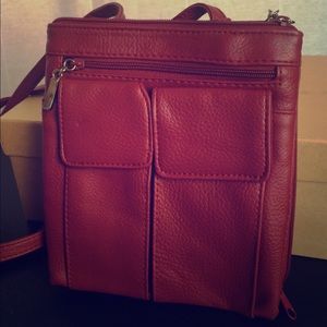 Red leather multi-pocket over the shoulder bag