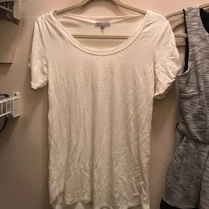 White shirt with cut outs on arm