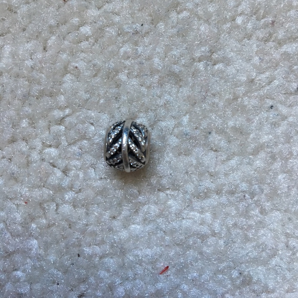 Silver pandora feather charm