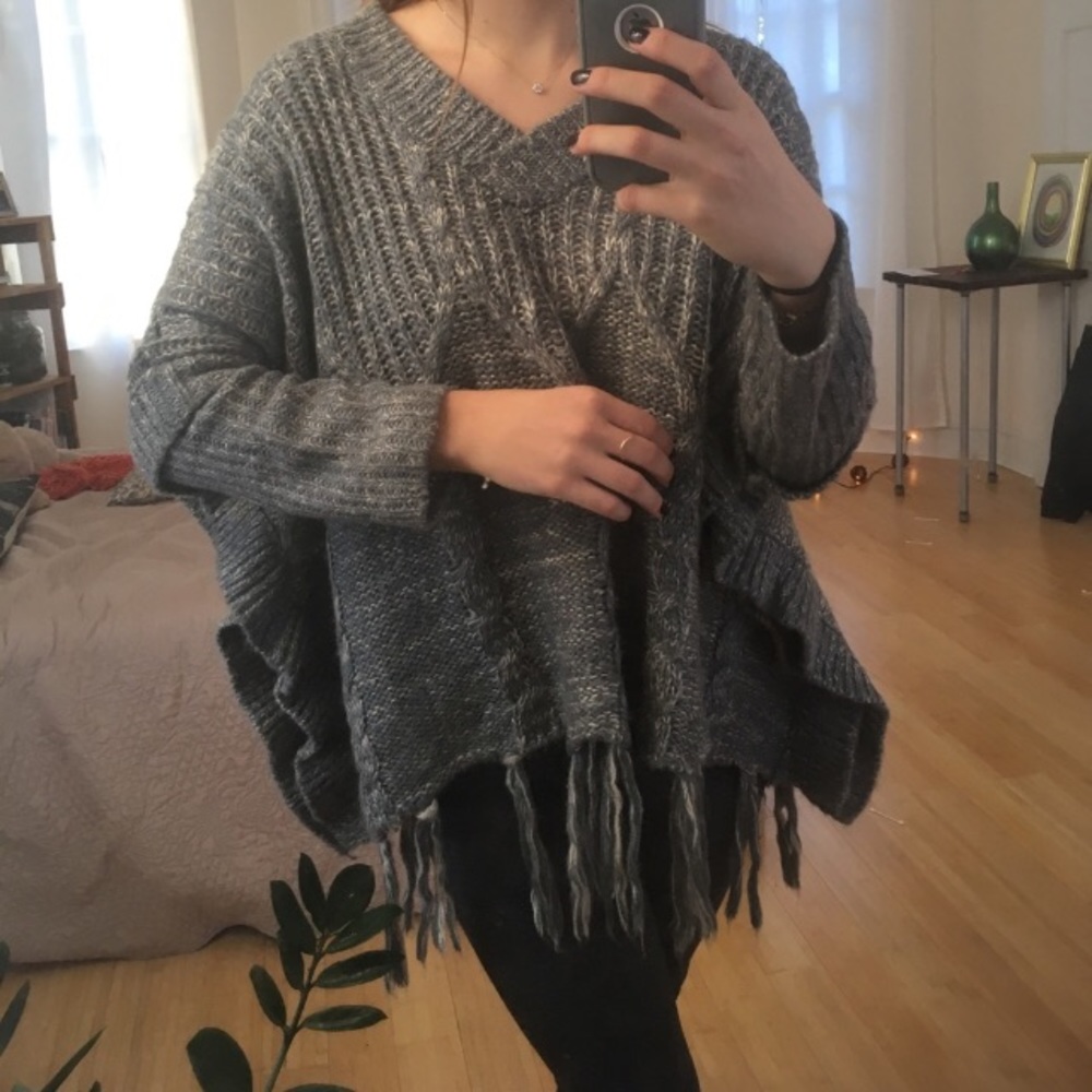 Bulky fringed poncho/sweater