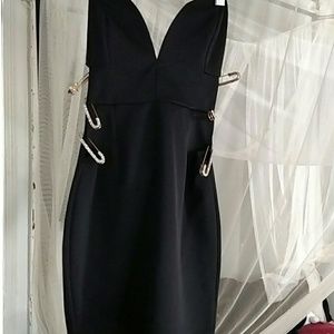 Black strapless dress, jewelled side pins