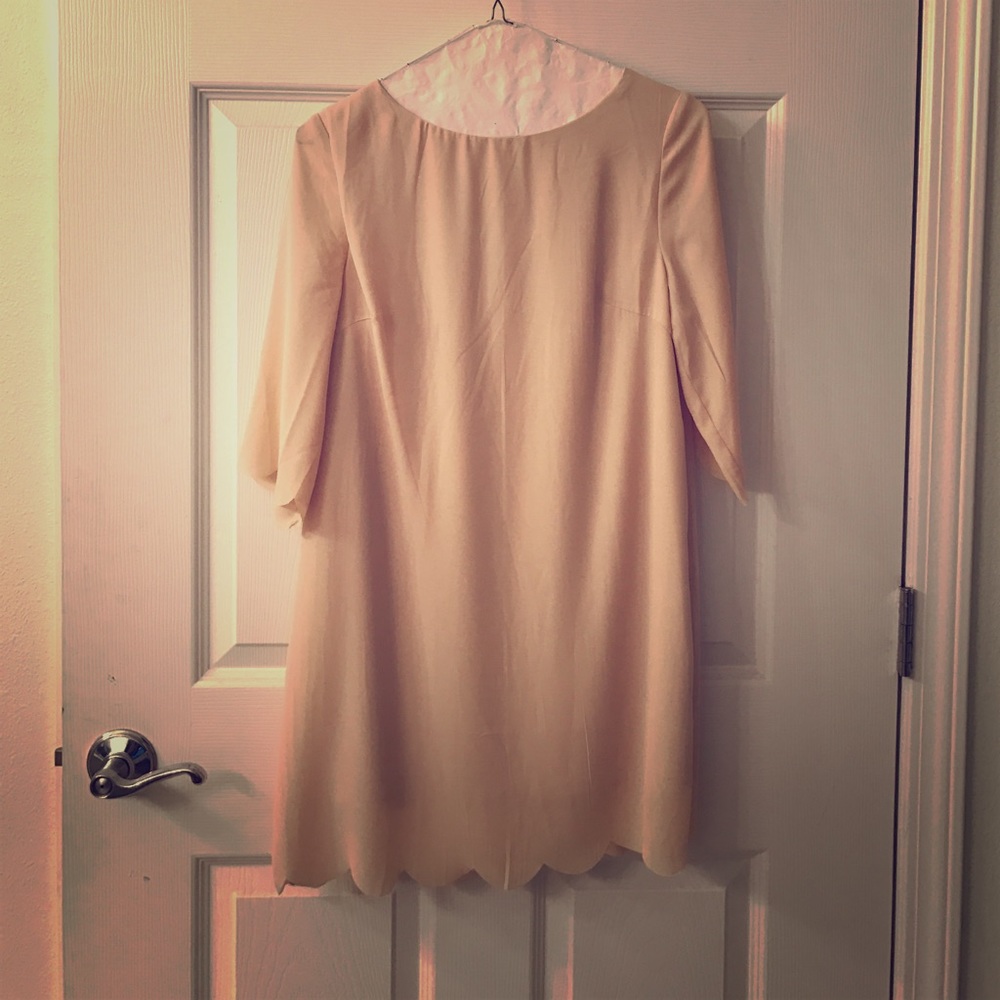 Tan shift dress with scalloped bottom and sleeves
