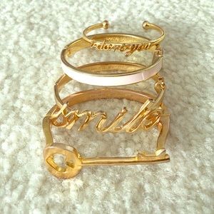 kate spade Jewelry - Listing is for 2 of 4 bangles. "Smile and key" kate spade Jewelry - Listing is for 2 of 4 bangles. "Smile and key"